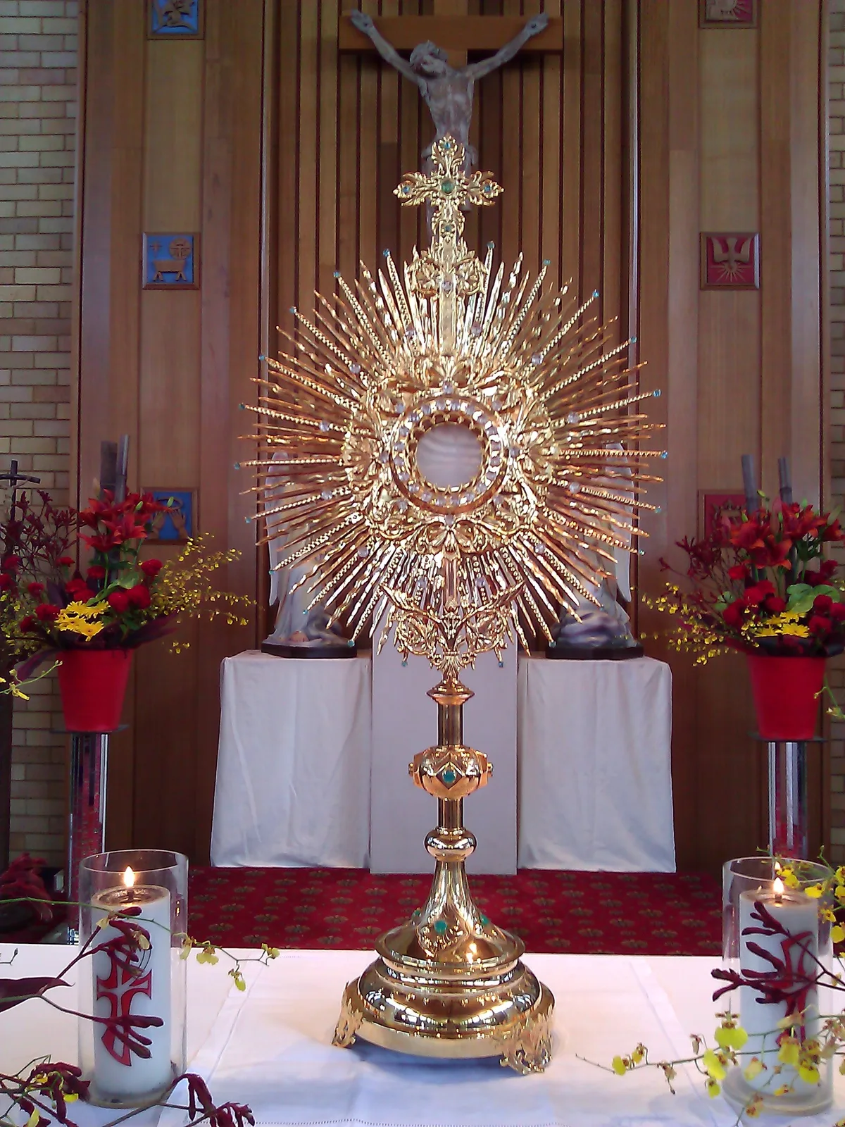 A gold monstrance displaying the Eucharist during adoration